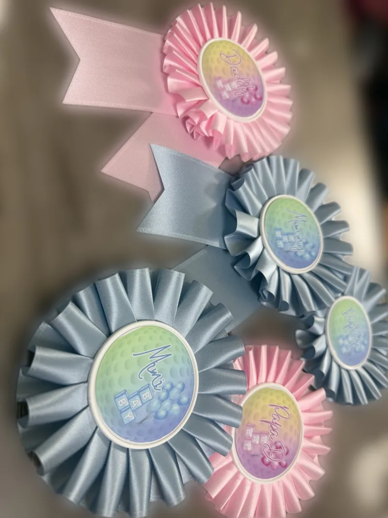 Pink and blue rosettes for a family celebration.