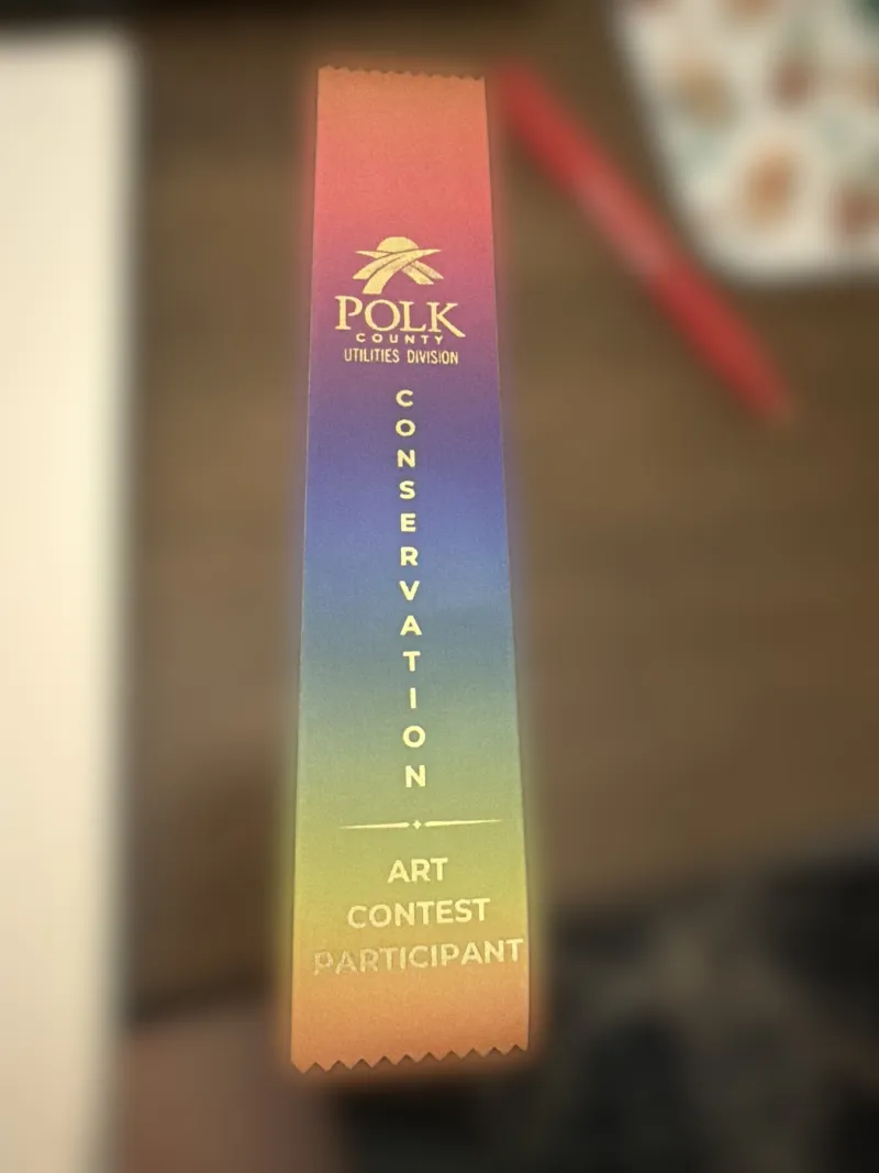 A rainbow ribbon for a creative achievement.
